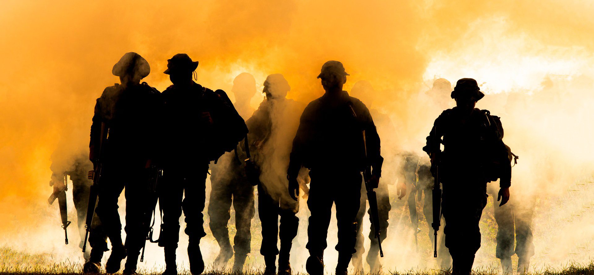 Military silhouettes fighting scene on war fog
